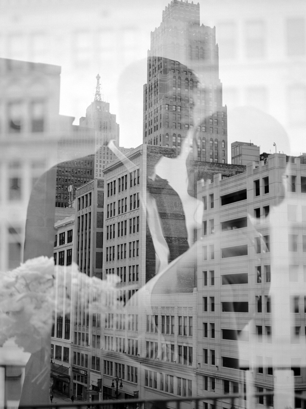 film double exposure, natural wedding photography, candid moment, cityscape, couple embrace