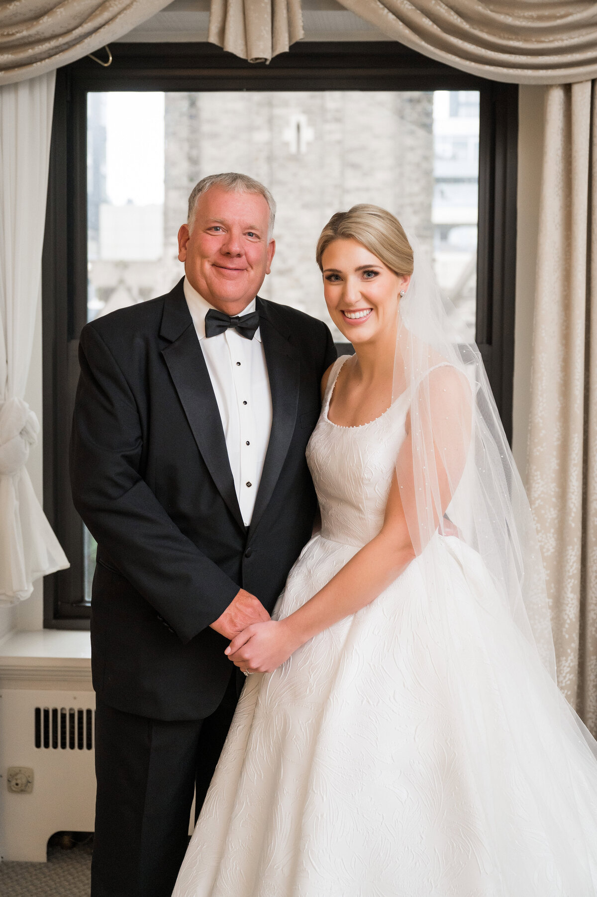 dad and bride posing for photo before wedding at duquesne club