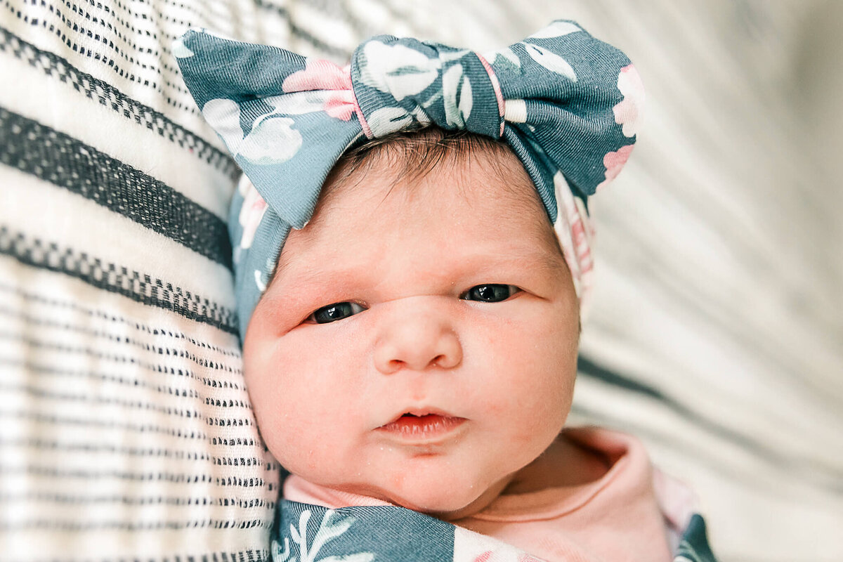 Baby with blue flower head band
