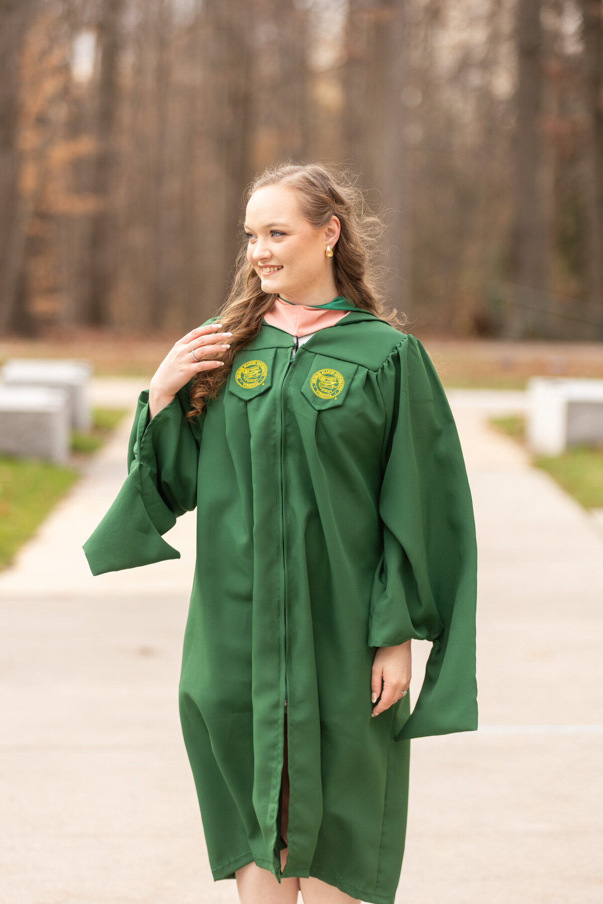 George Mason Graduation Photo in her graduation gown located in Fairfax, Virginia 