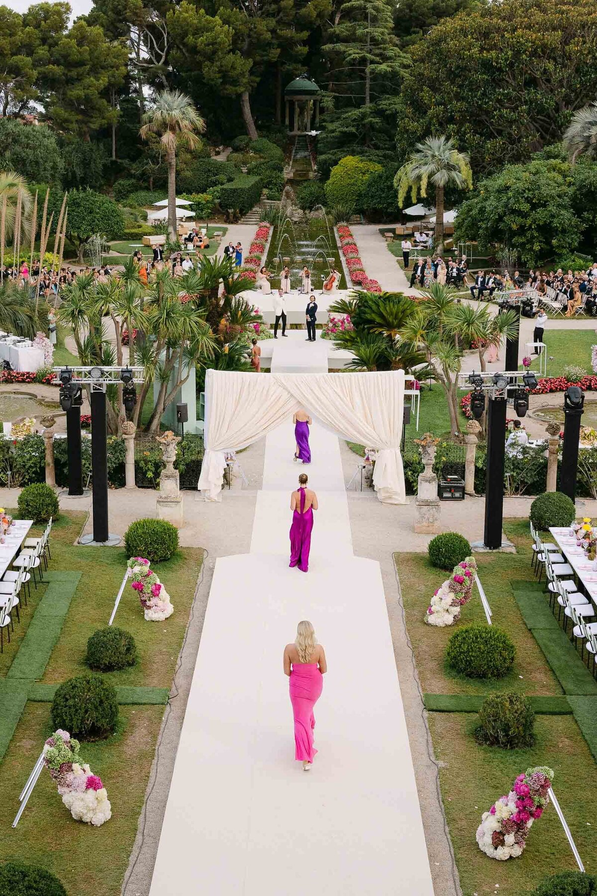 Bridesmaids walking down the aisle for the ceremony at VIlla Ephrussi.