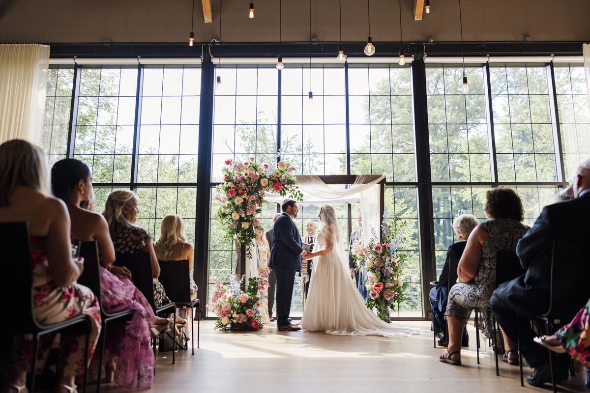 Indoor ceremony photo during daytime at The Roundhouse