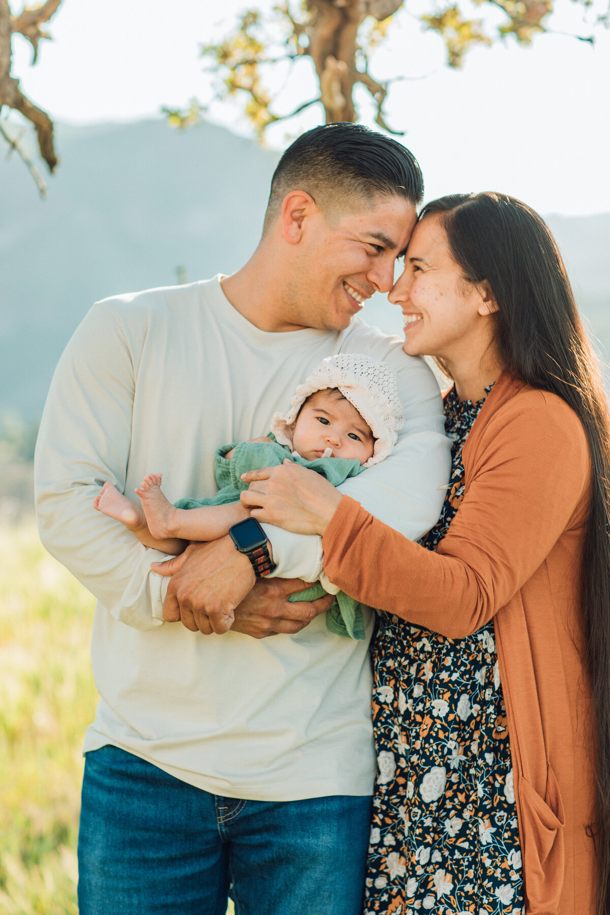 Family Portrait Photo Of Couple holding Each Other With Their Baby Los Angeles