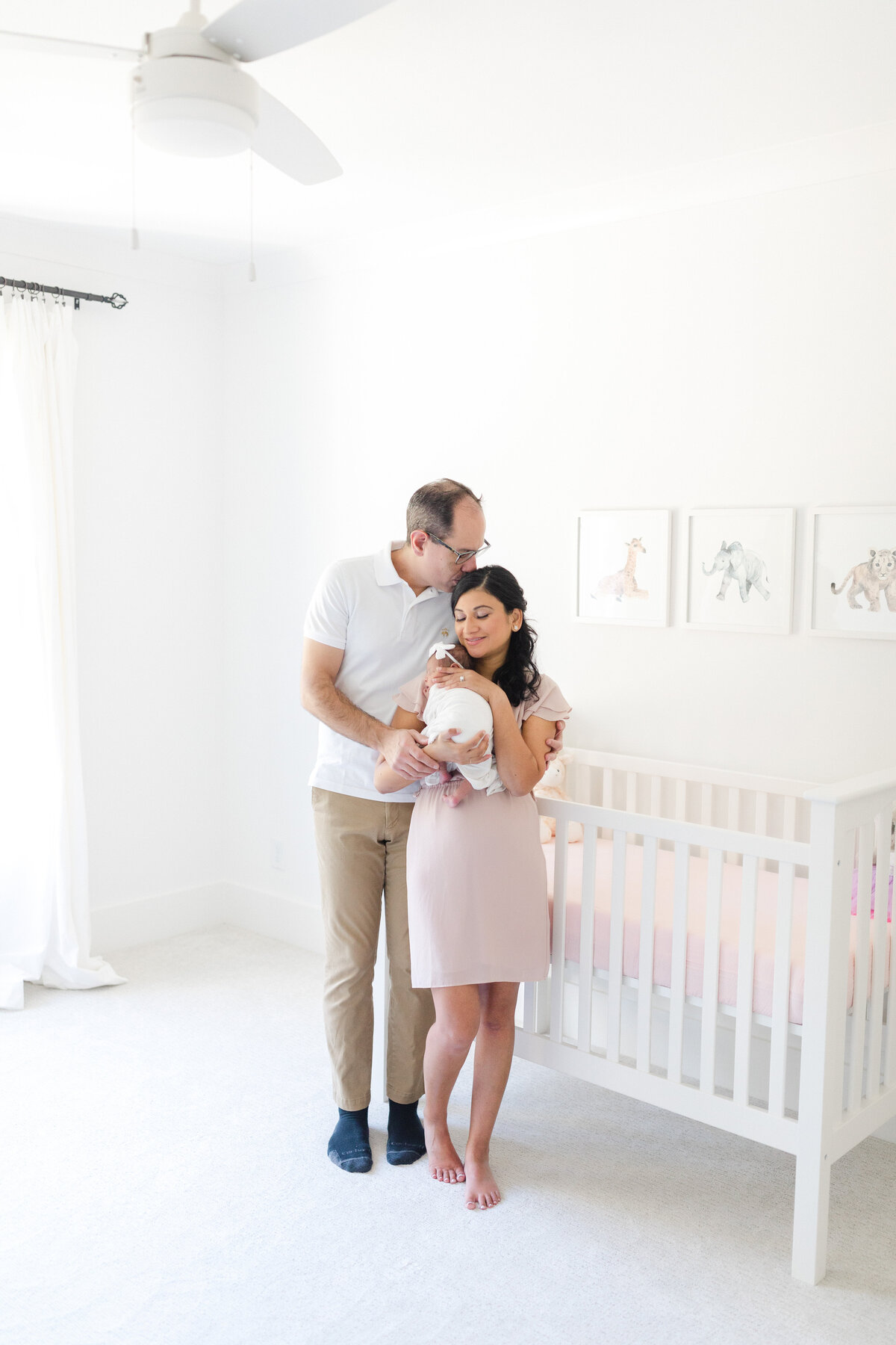 Brookhaven Newborn Photography- parents in baby girl nursery holding newborn