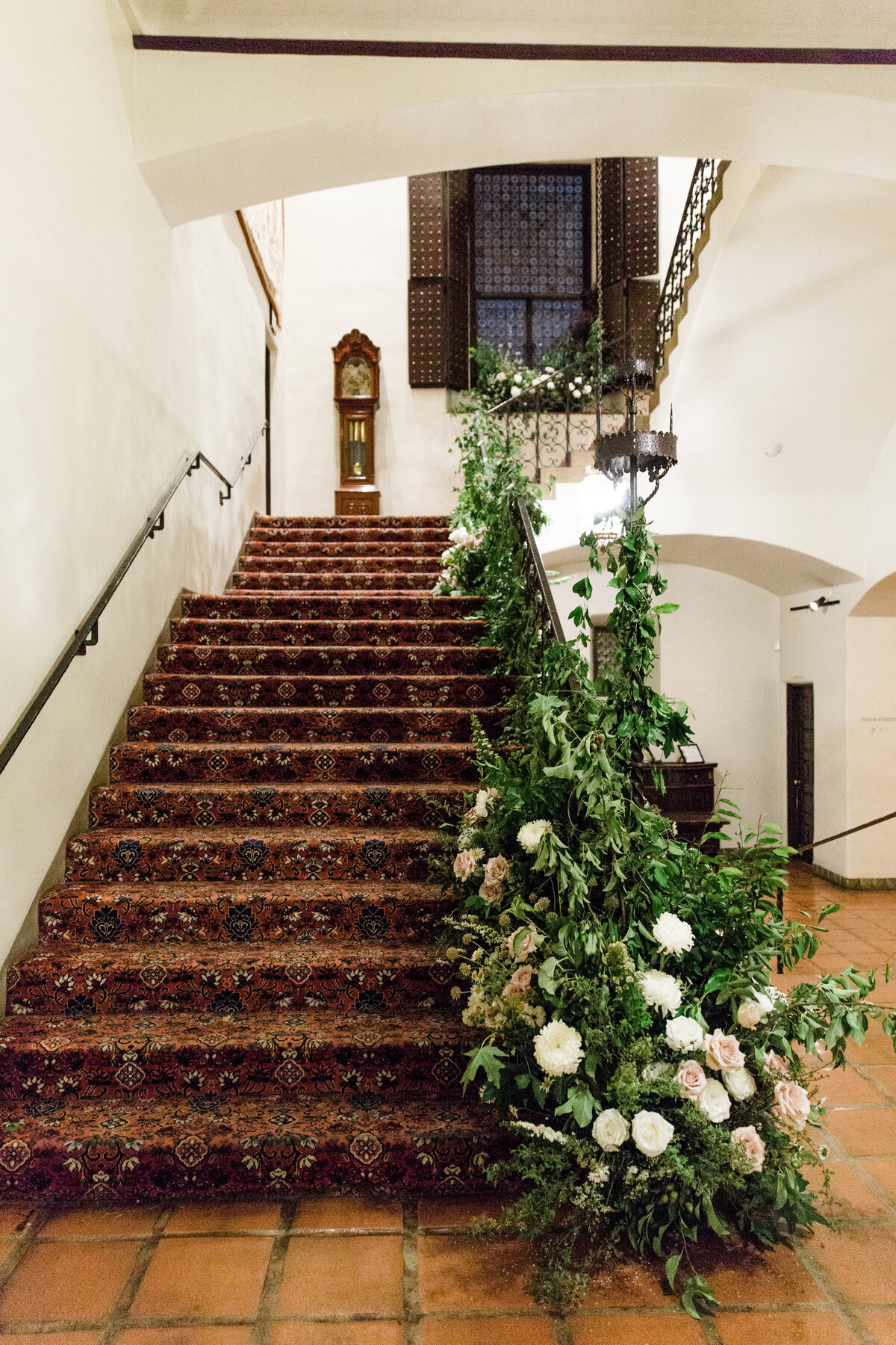 a long staircase decorated with flowers