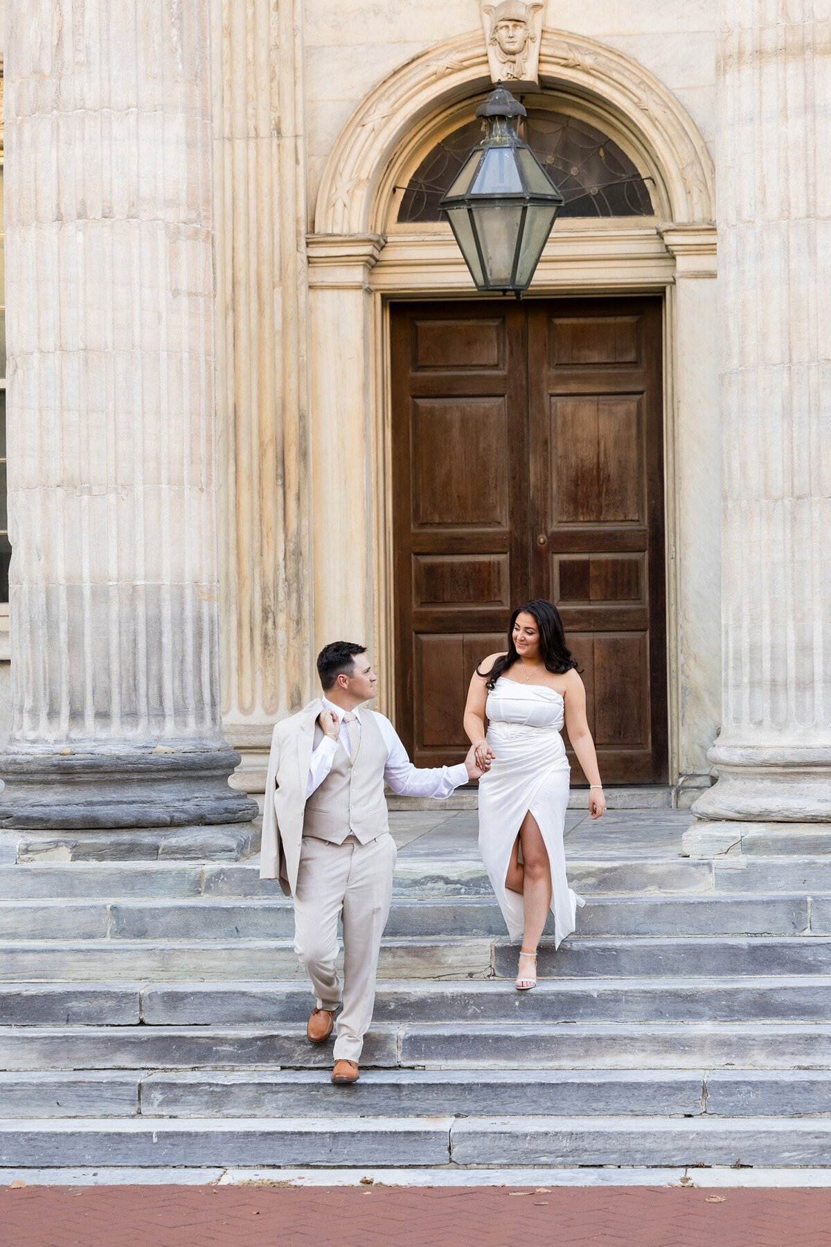 newly-engaged-couple-walking-stairs