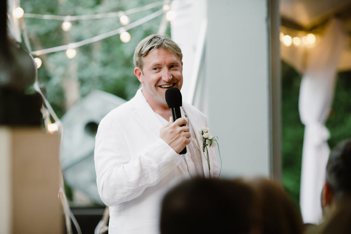 Man making a speech at Umlauf Sculpture Garden wedding, Austin