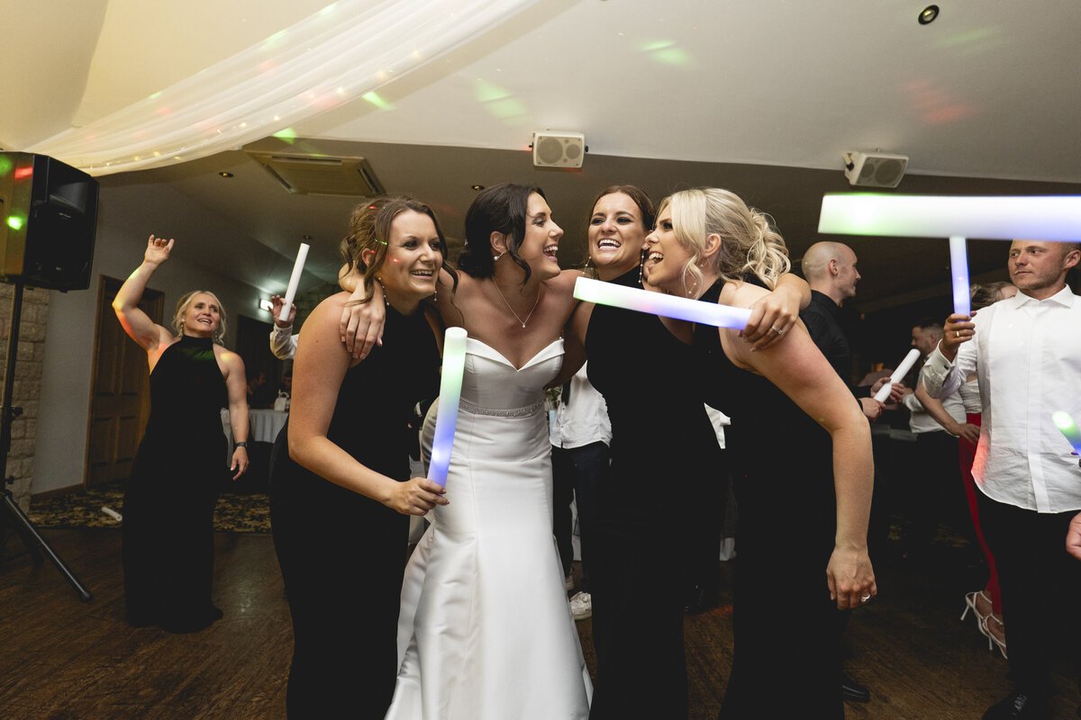 Amy and her bridesmaids dancing together