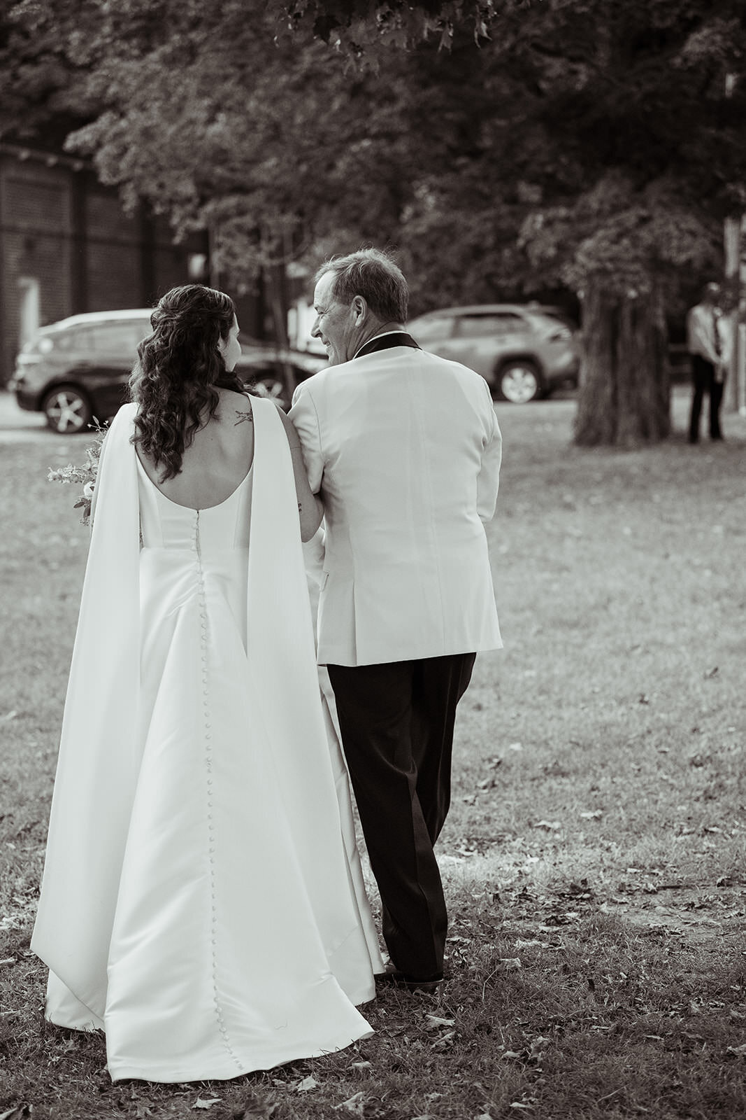 Bride walking hand in hand with her dada