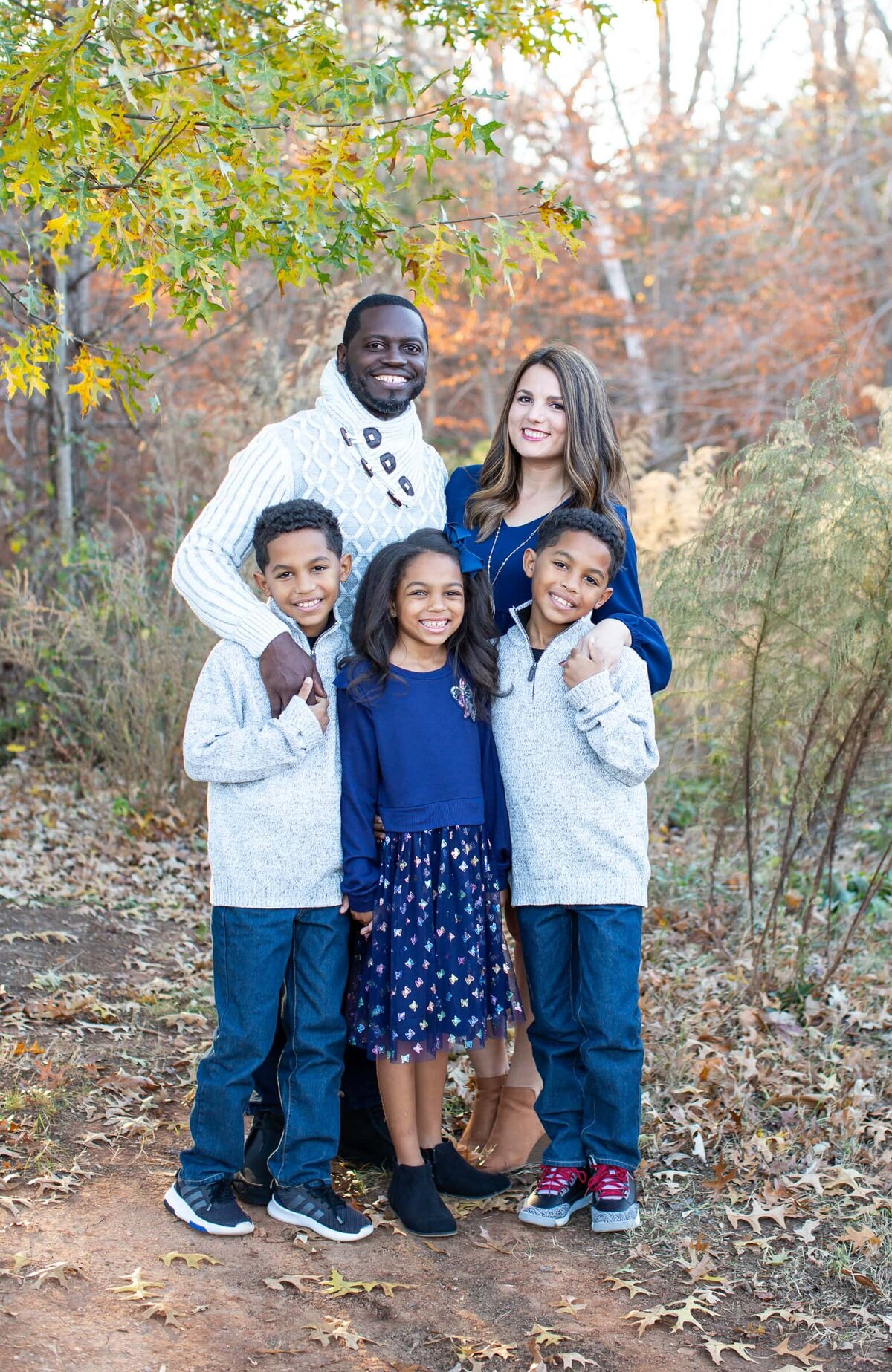 best family photographers Raleigh  NC family of 5 fall portrait captured in a park