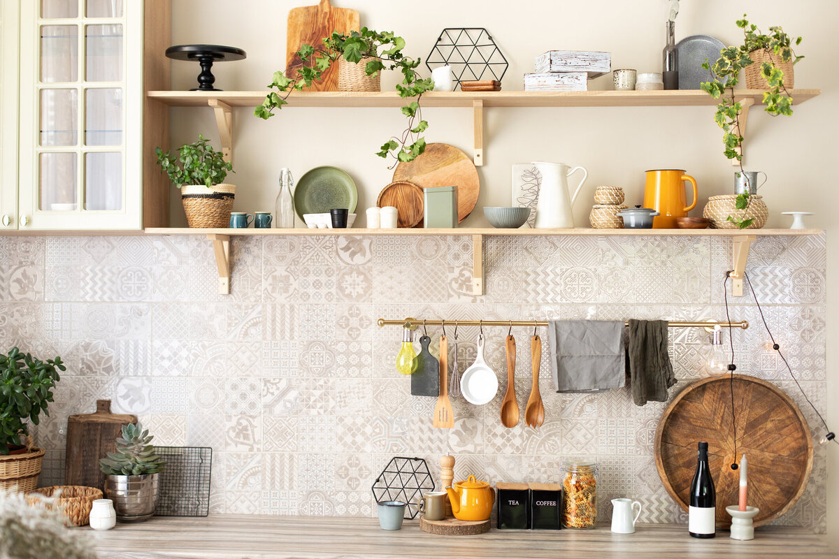 stylish-scandi-cuisine-interior-decor.-ceramic-plates,-dishes,-utensils-and-cozy-decor-on-wooden-shelfs.-kitchen-wooden-shelves-with-various-ceramic-jars-and-cookware.-open-shelves-in-the-kitchen.-1422978491_212