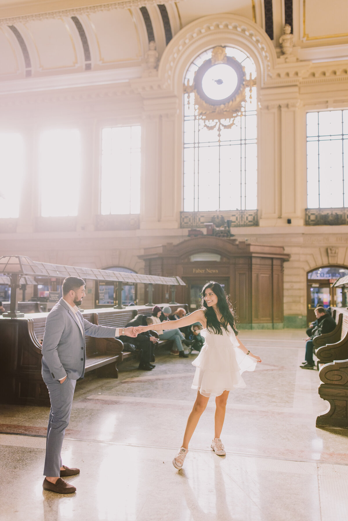 A couple dancing inside the hoboken terminal lackawanna station waiting area
