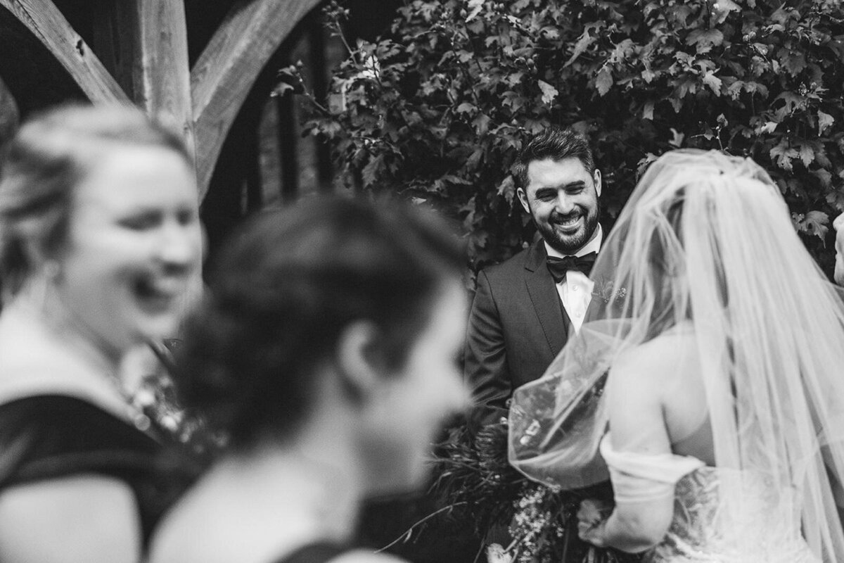 A person smiling at their partner on their wedding day 