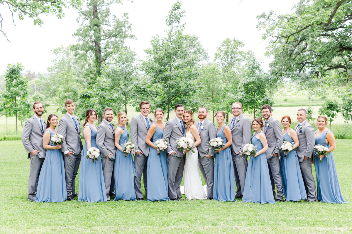33_large_wedding_party_in_blude_bridesmaid_dresses_and_gray_suites_olin_park_madison