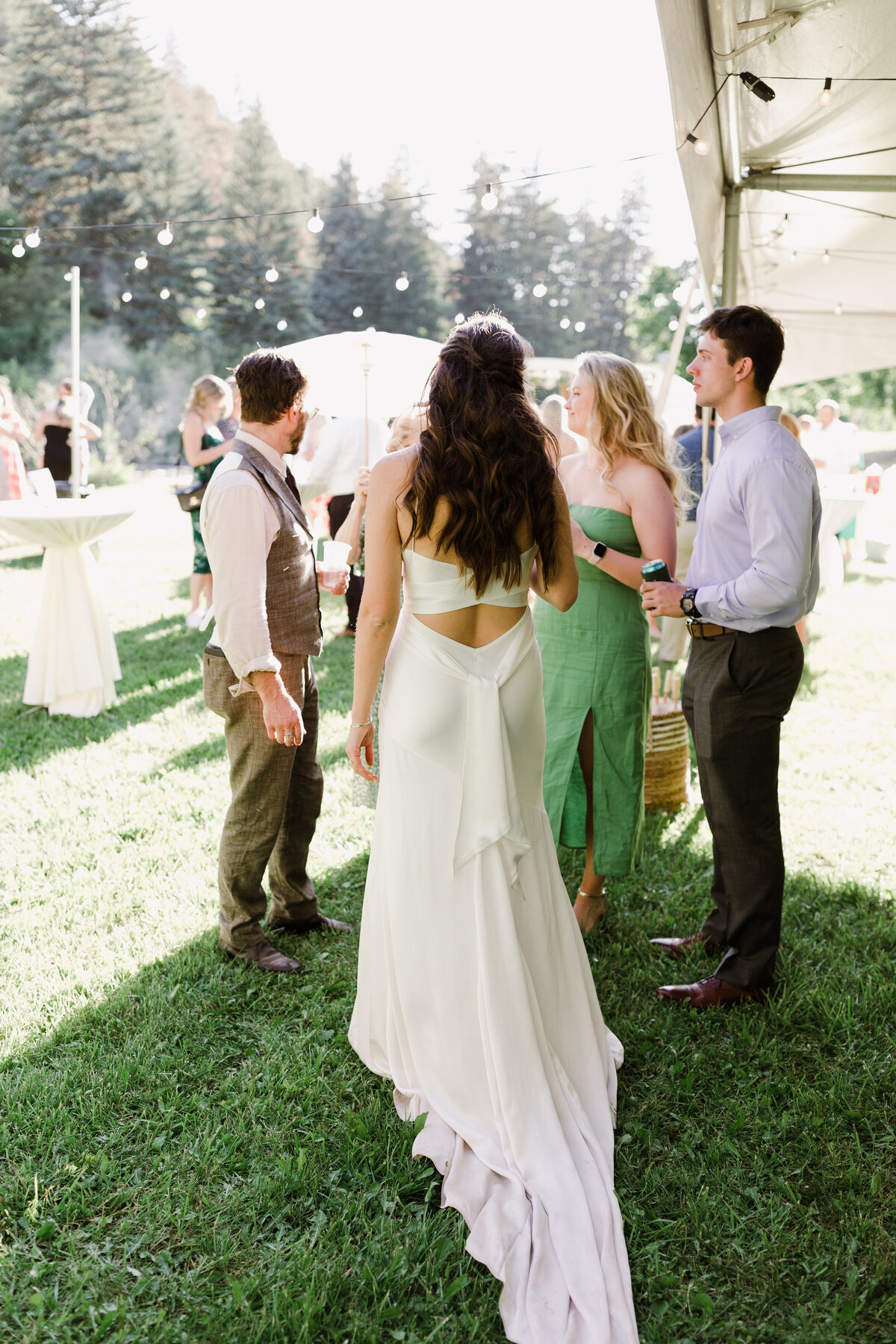 Bride mingling with guests at Dallenbach Ranch Colorado Wedding