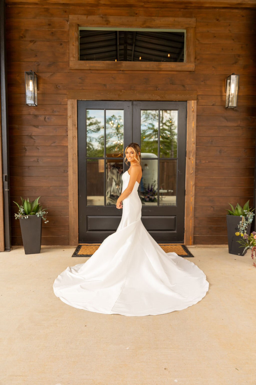 Bride in front of the Reception space at The Rosewoo