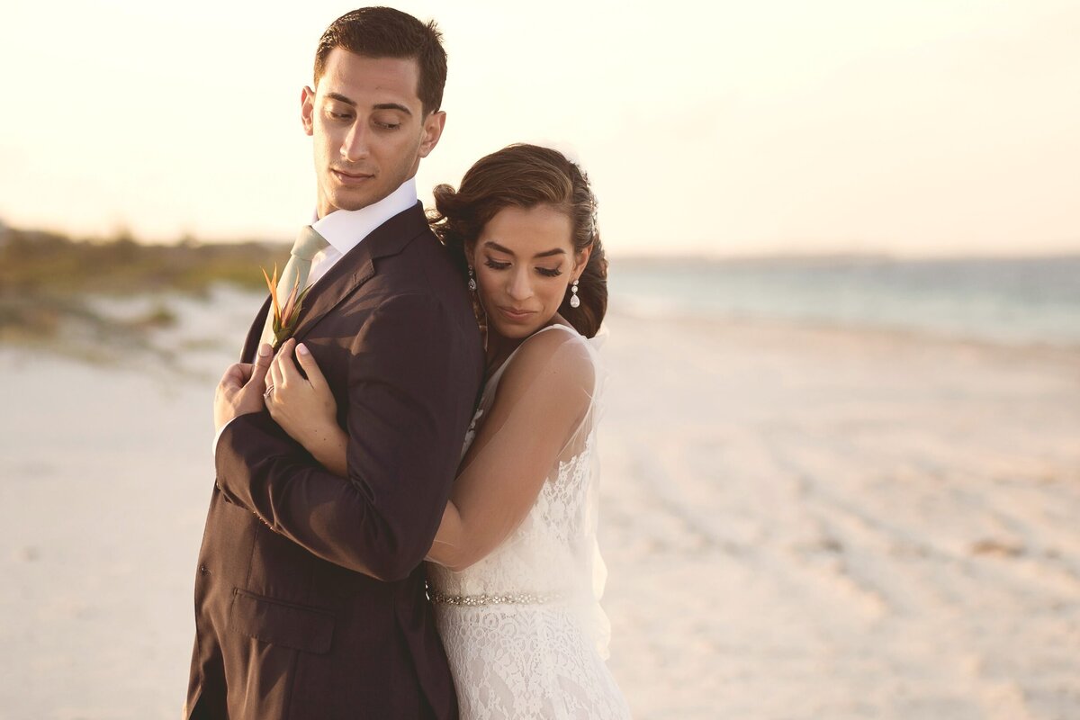 Bride hugging groom after wedding in Cancun