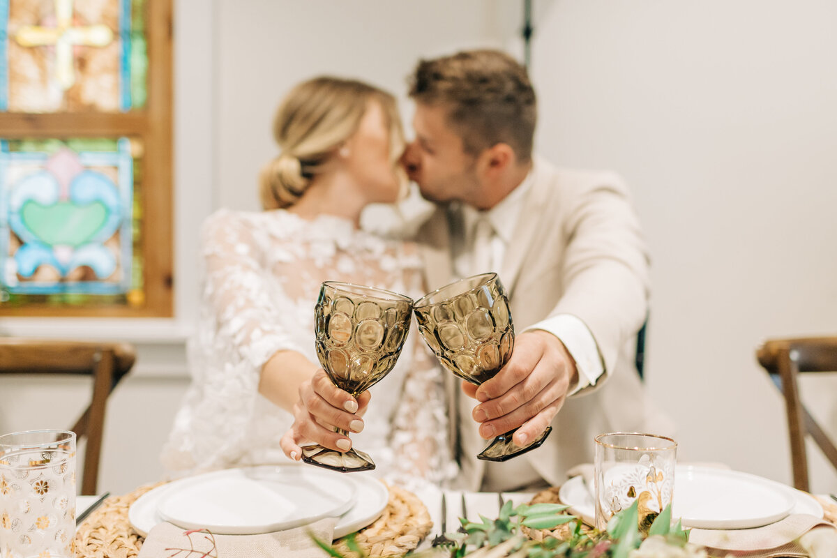 bride and groom doing cheers