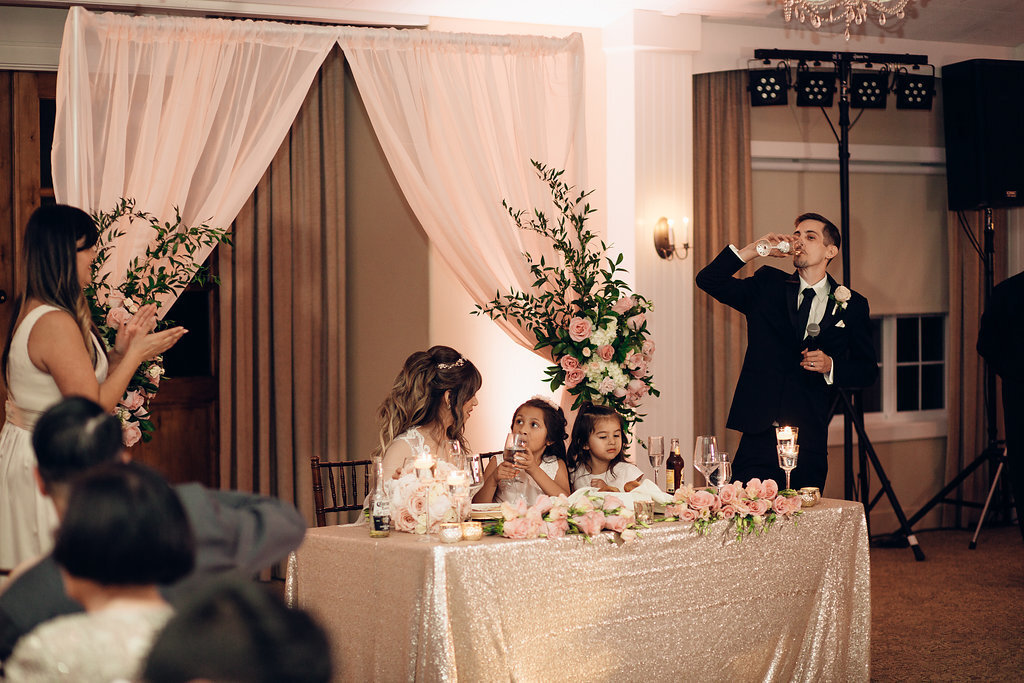 Wedding Photograph Of Groom Drinking From His Wine Glass Los Angeles