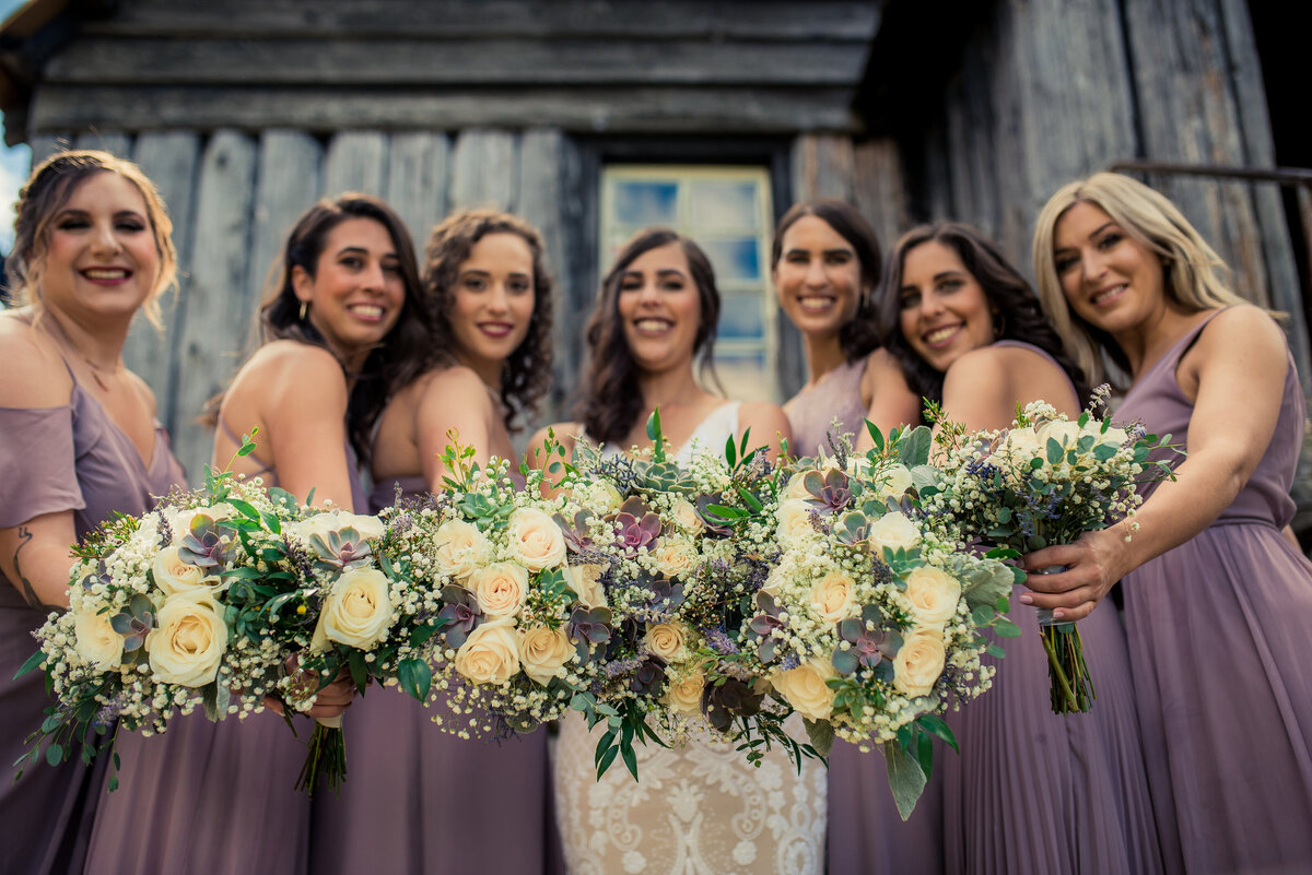 bridesmaids holding bouquets