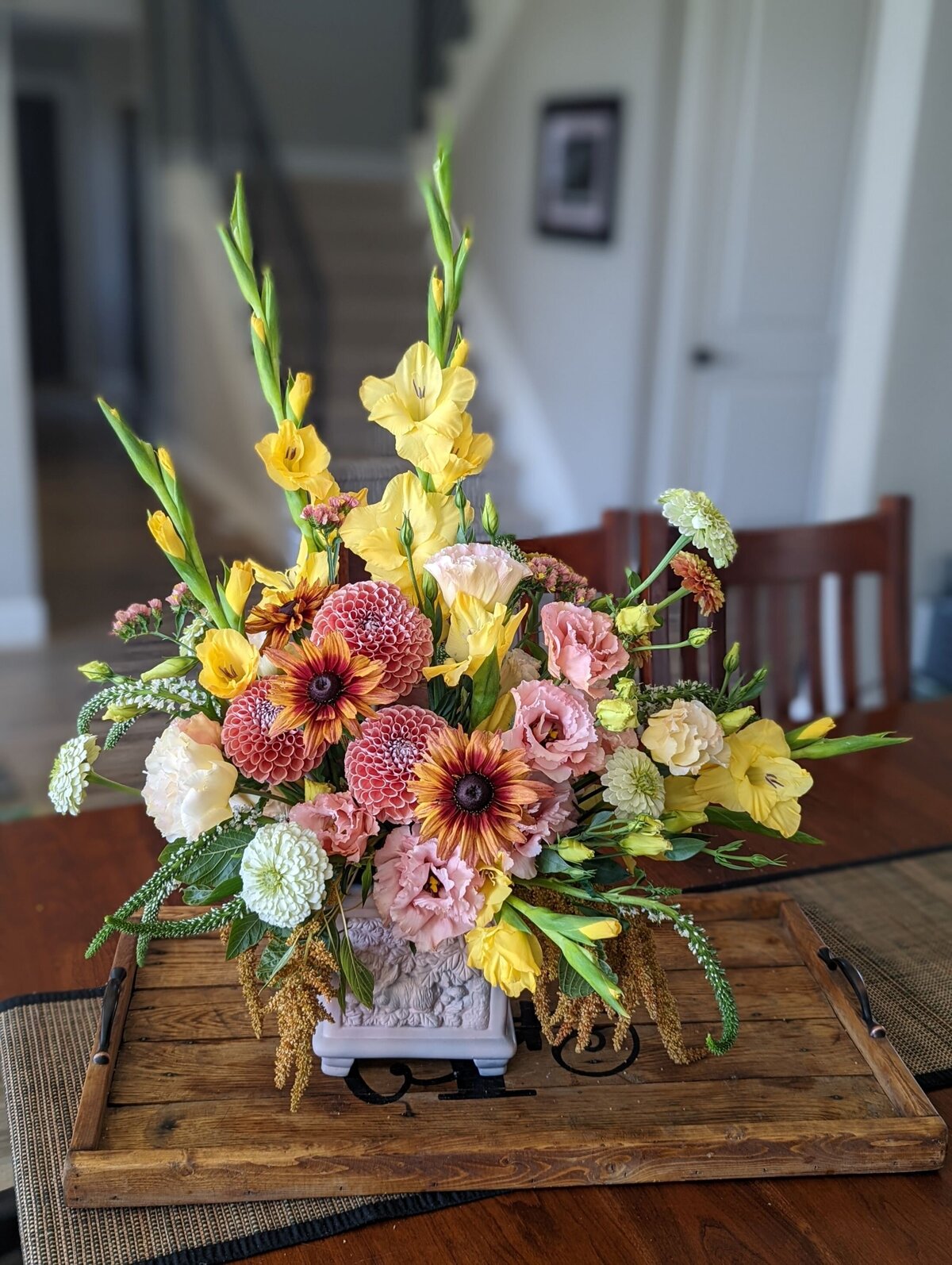bright funeral flower arrangement in vase