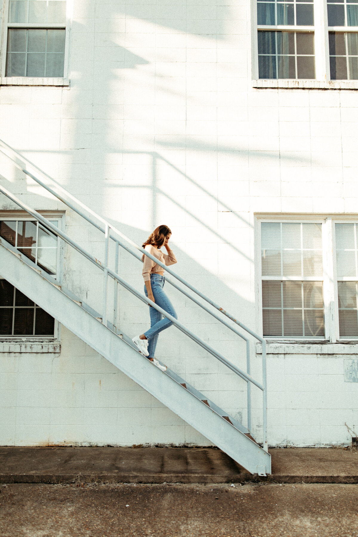 Girl walking down staircase downtown