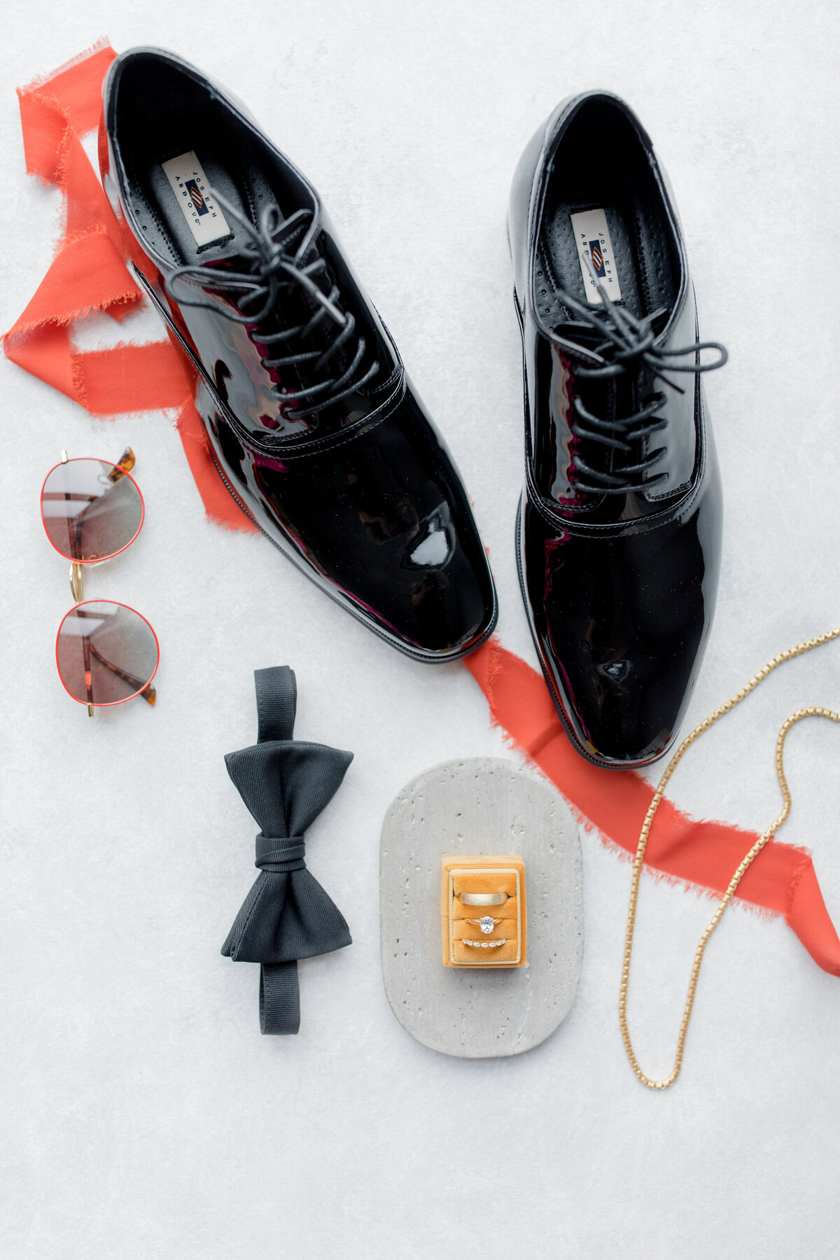 groom details including shoes, bowtie and sunglasses
