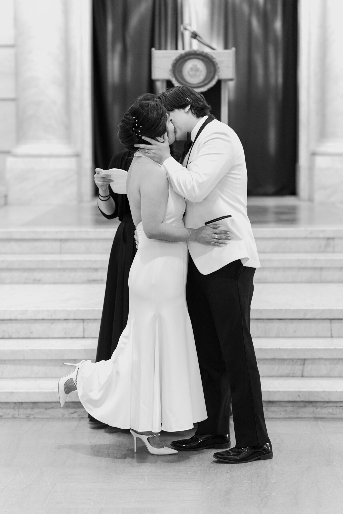 Black and white image of couple's first kiss at their courthouse elopement in Wilkes-Barre Pennsylvania