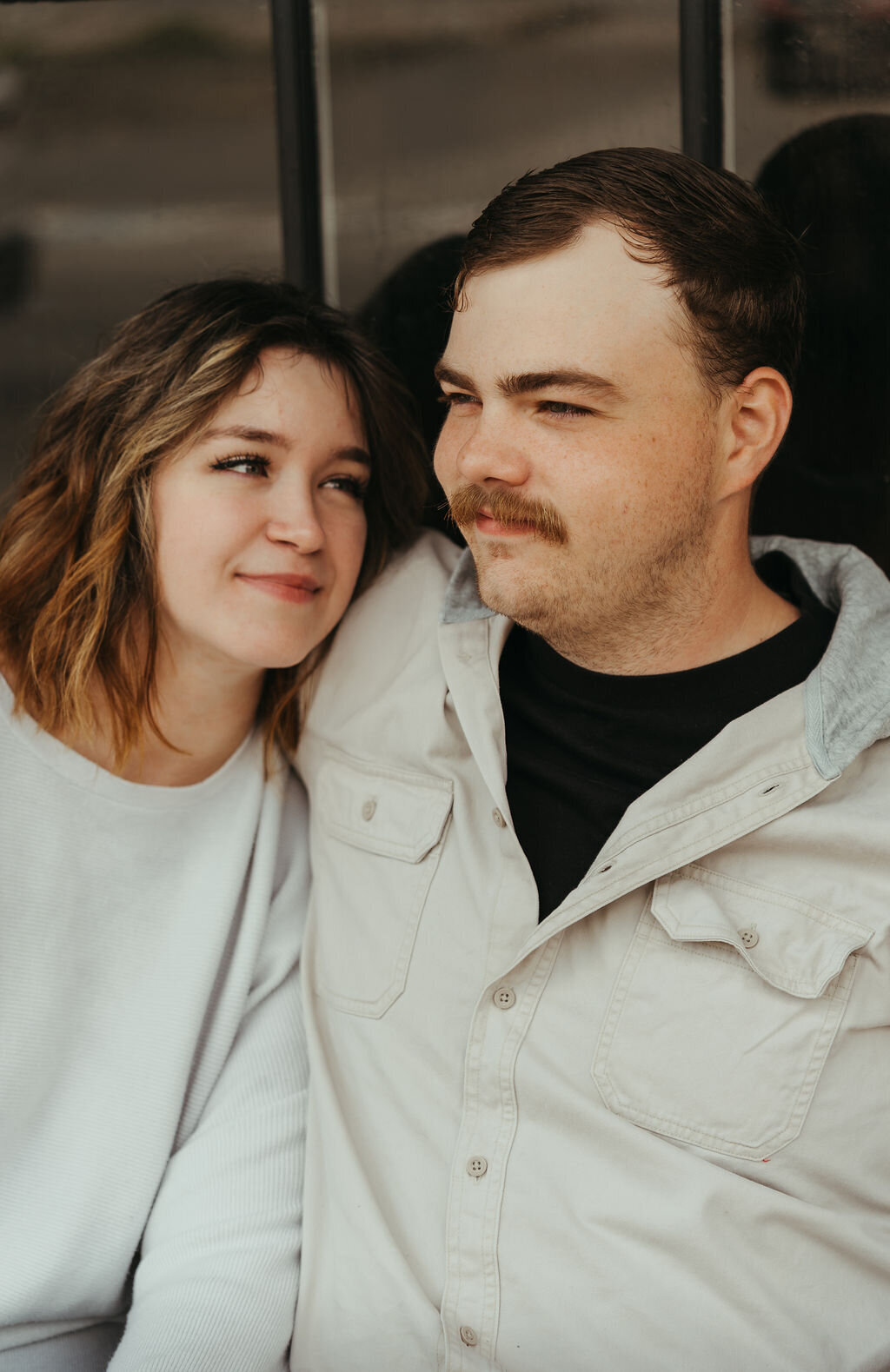 Candid photo of woman glancing lovingly at fiance