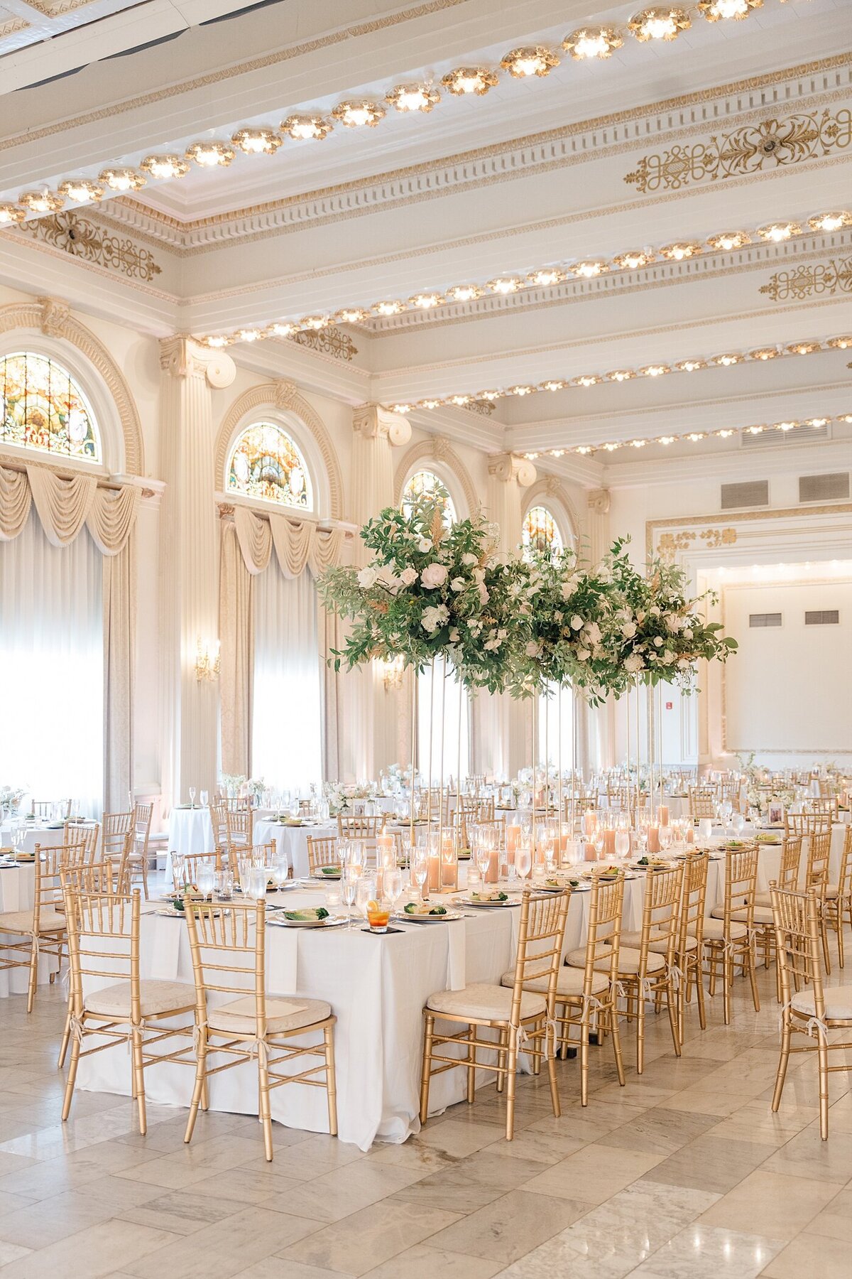 the Westin wedding venue reception hall with grand florals, gold details and bright open lighting