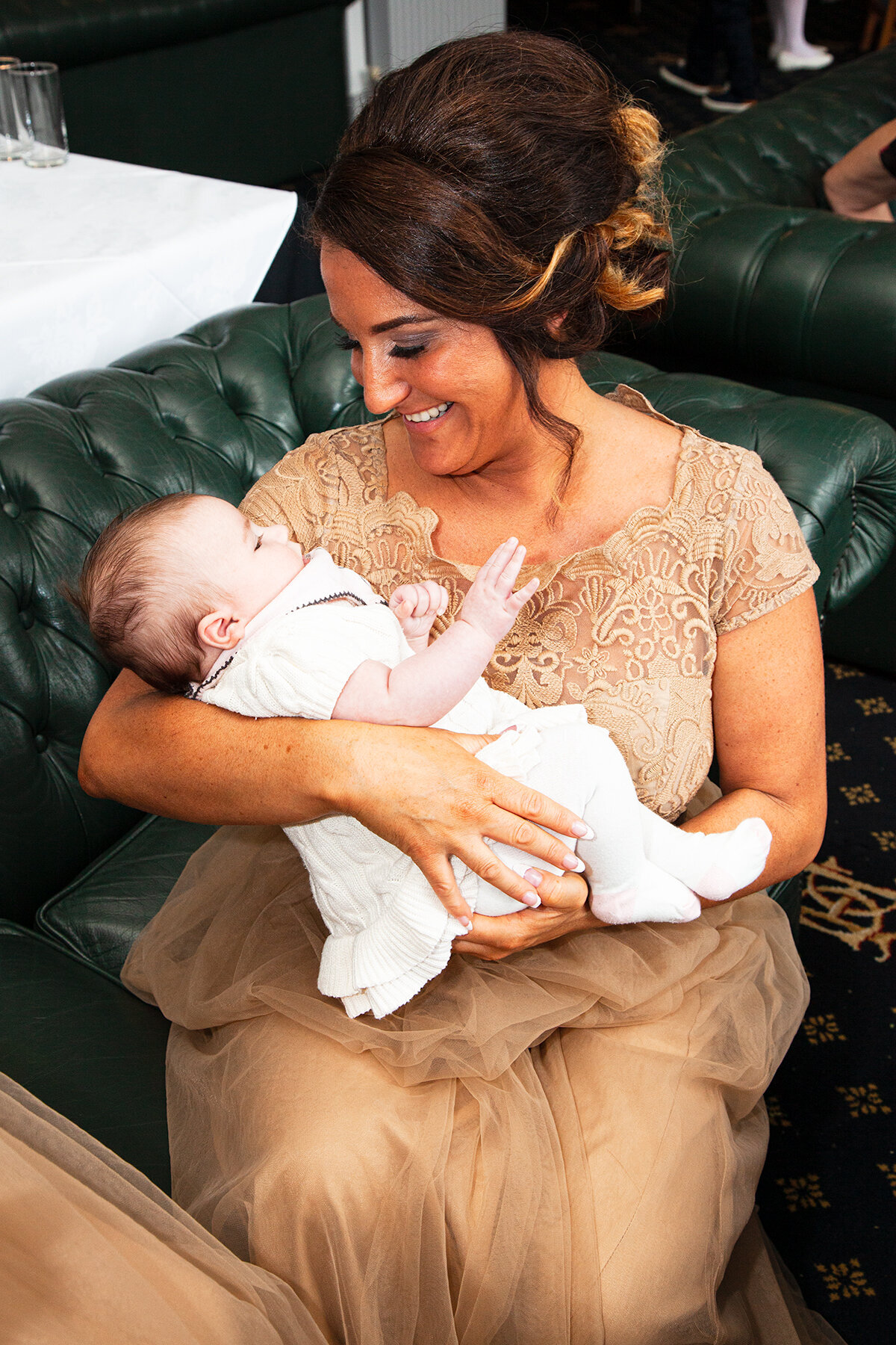 pro-story-photography_bridesmaid-holding-baby-happy-days_duke-of-cornwall_plymouth