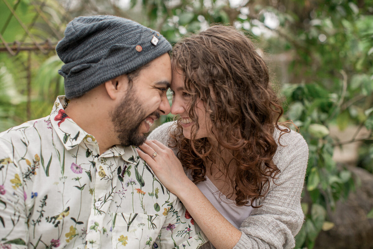 A couple look into each other's eyes during their engagement session.