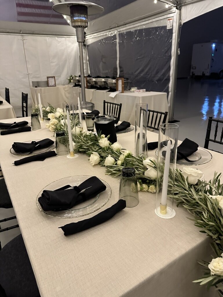 black and white, taper candles, garland, tucked in flowers, white flowers, olive 