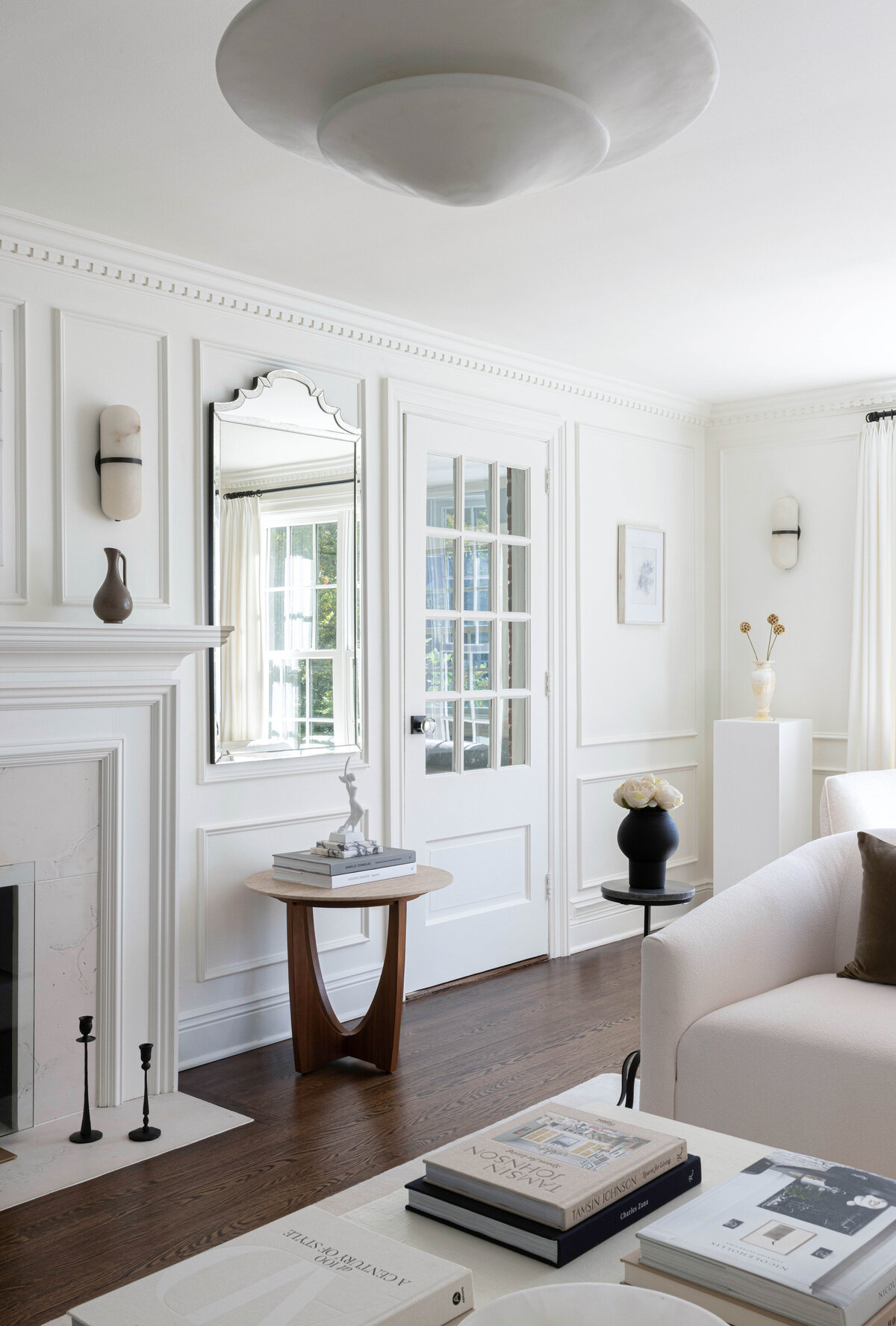 A sophisticated and elegant living space featuring custom millwork, chic furnishings, and timeless design. This luxury interior by Deni + Dove Interiors blends modern refinement with classic details, perfect for high-end homes in Short Hills, Montclair, Summit, Ridgewood, and beyond.