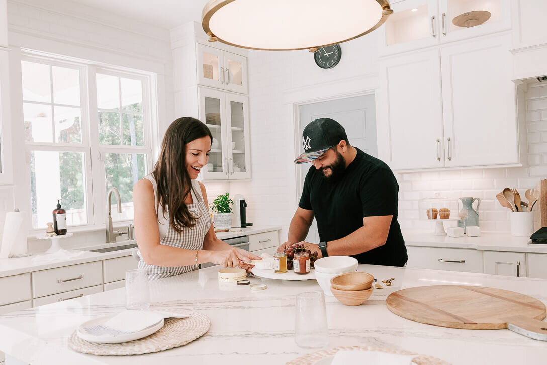 married couple preparing snacks for family in raleigh