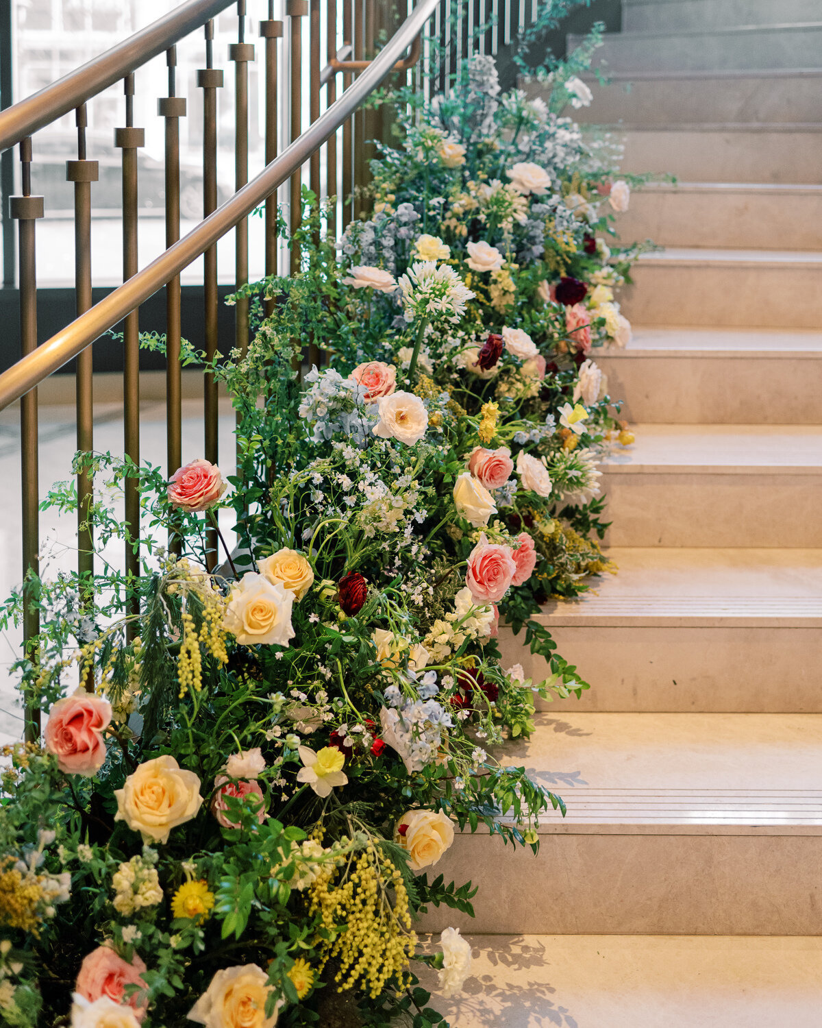wild flowers up stairs Conrad Nashville hotel wedding