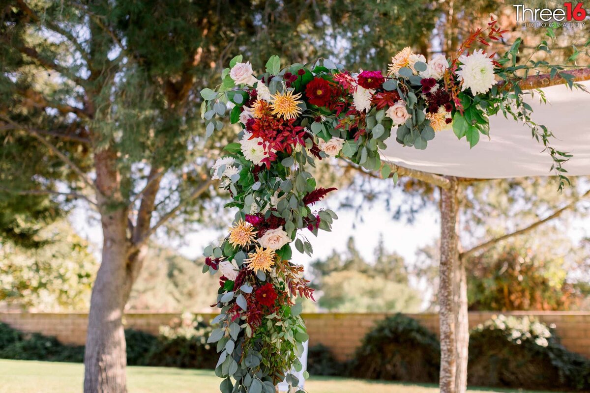 The Chuppah is decorated with a floral arrangement prior to the wedding ceremony