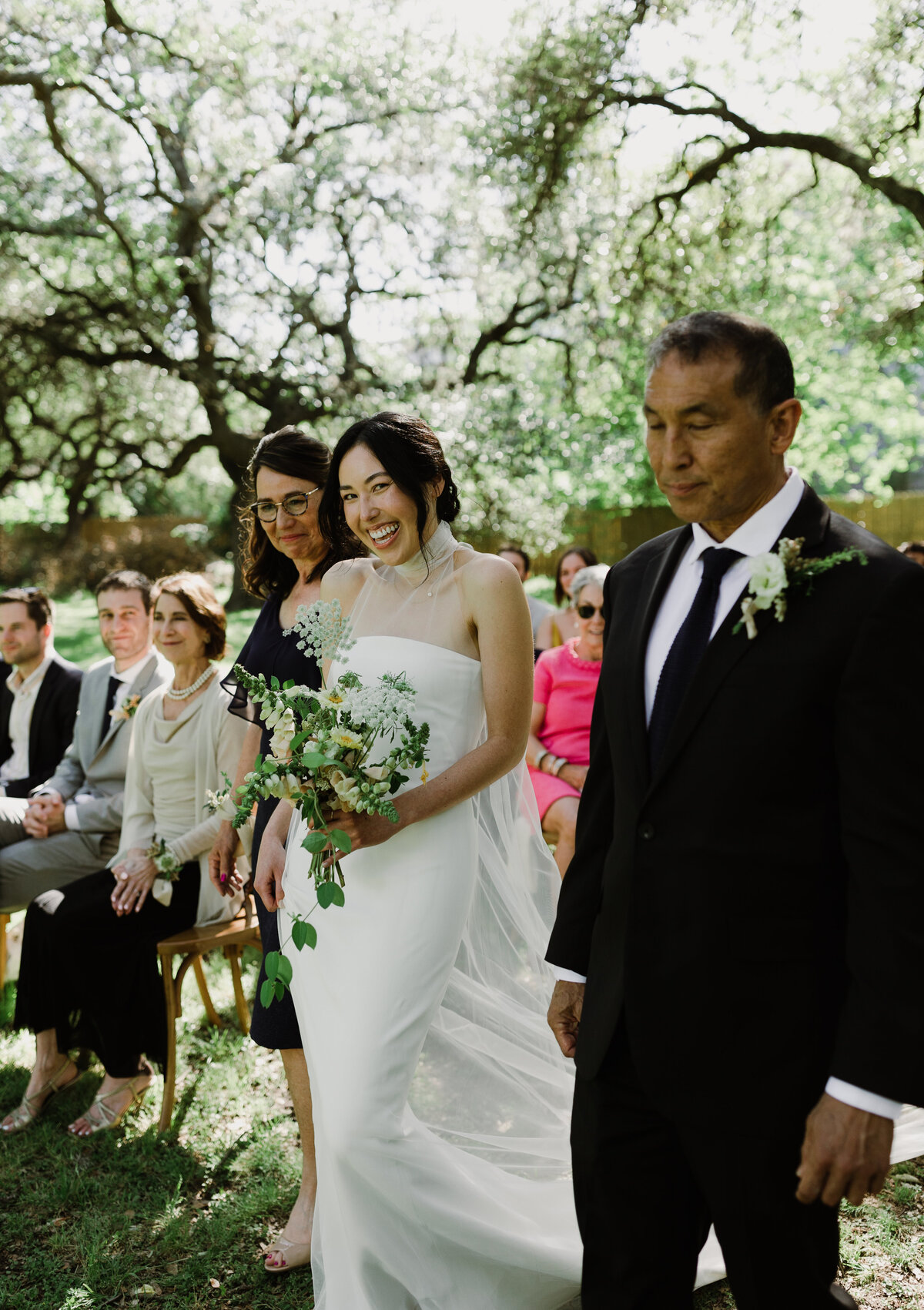 Bride walking down the aisle at outdoor wedding ceremony at  Mattie's Austin