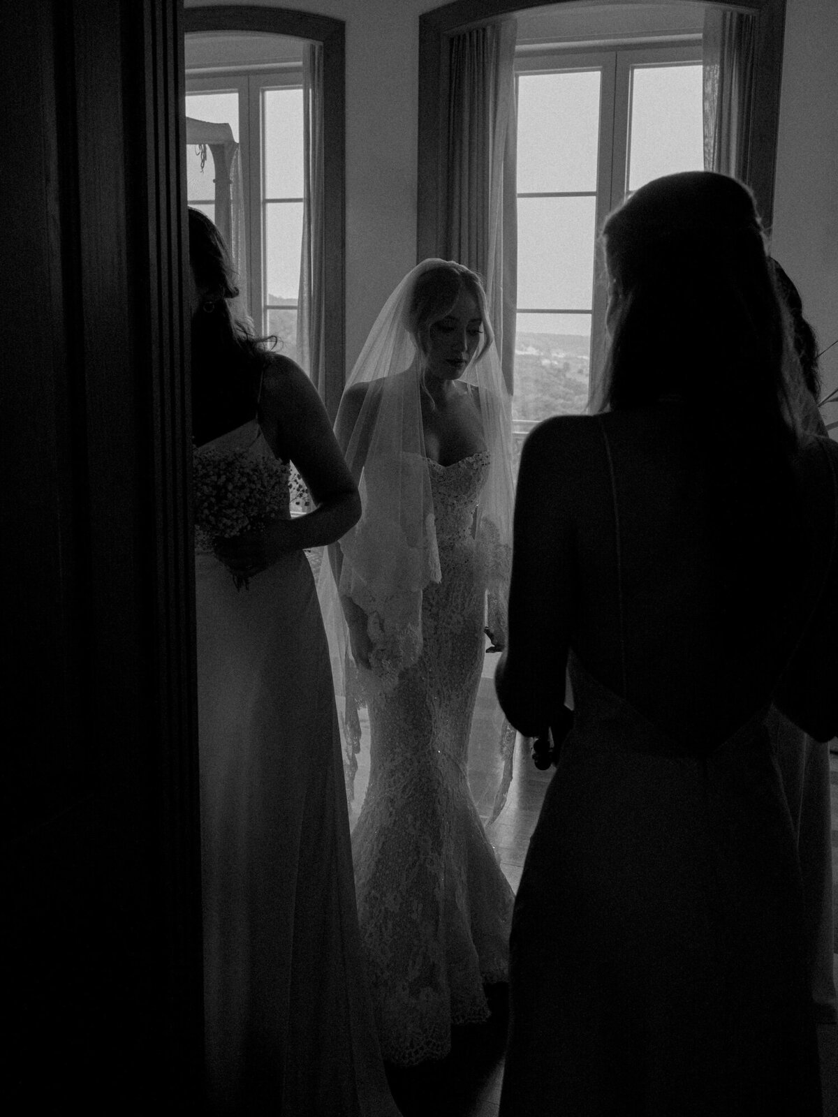 The bride exiting her room during getting ready for her destination wedding in Quinta da Bellavista