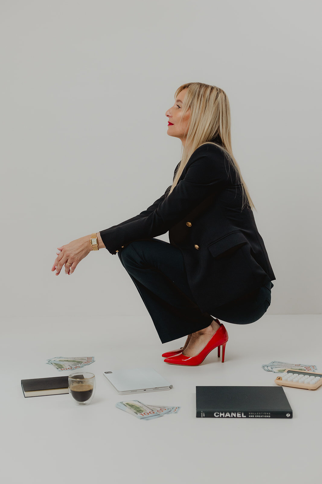 professional woman in black with red heels