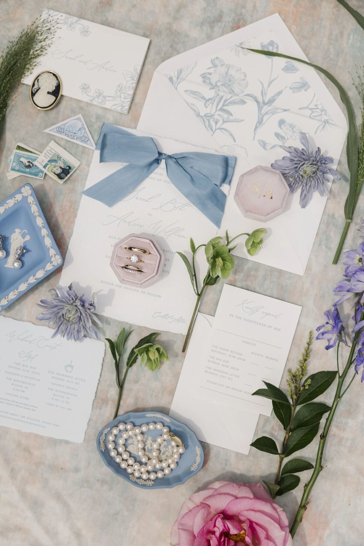 Wedding detail photos at The Roundhouse with invitations and rings