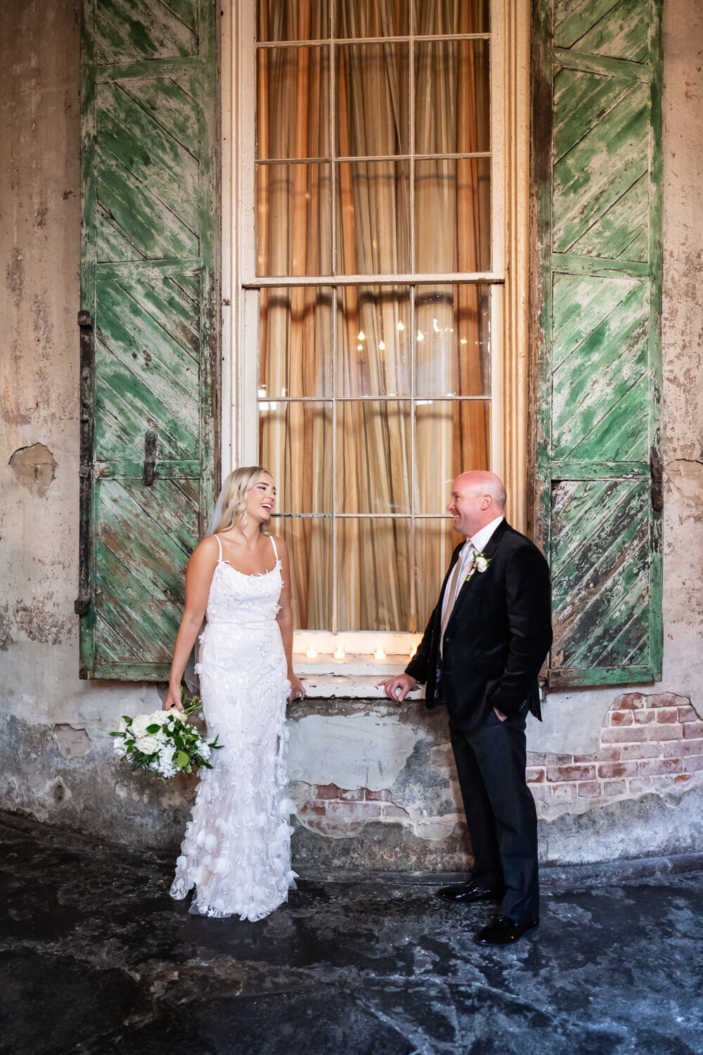 Couple in front of window and old shutters in Latrobe's
