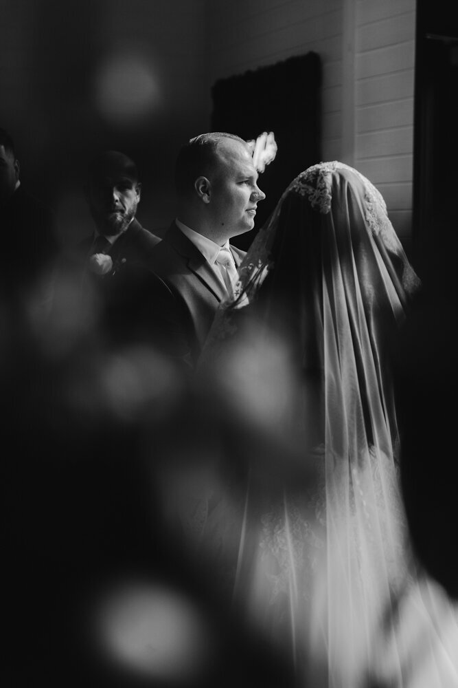 storyteller-collective-photo-co-black-and-white-emotional-vow-moment-ashton-hill-farm-cedar-rapids-iowa