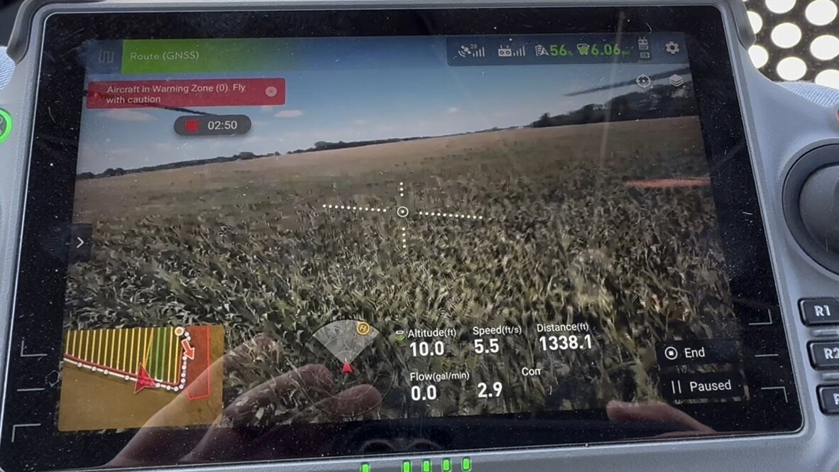 Plot's view of the remote while flying agriculture drones