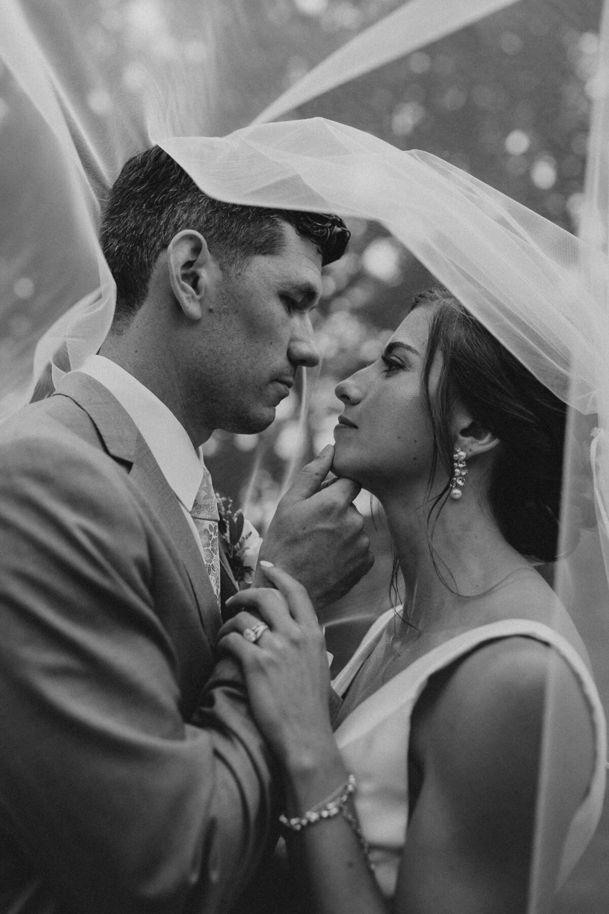 black-and-white-bride-and-groom-portrait-under-veil