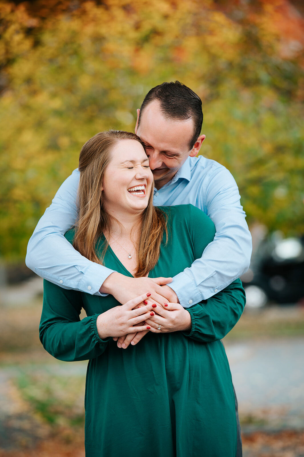 couple laughing at woodstock inn vermont foliage engagement fall