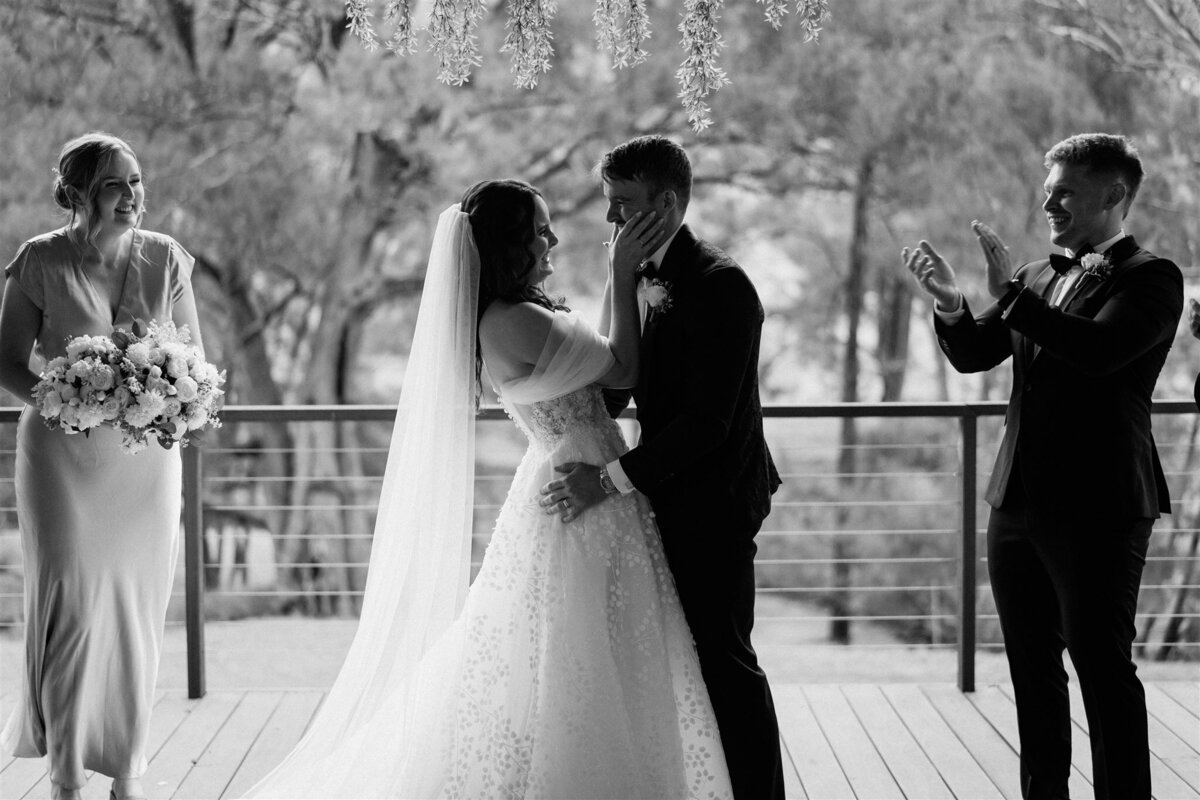 A couple shares their first kiss as husband and wife during the ceremony.