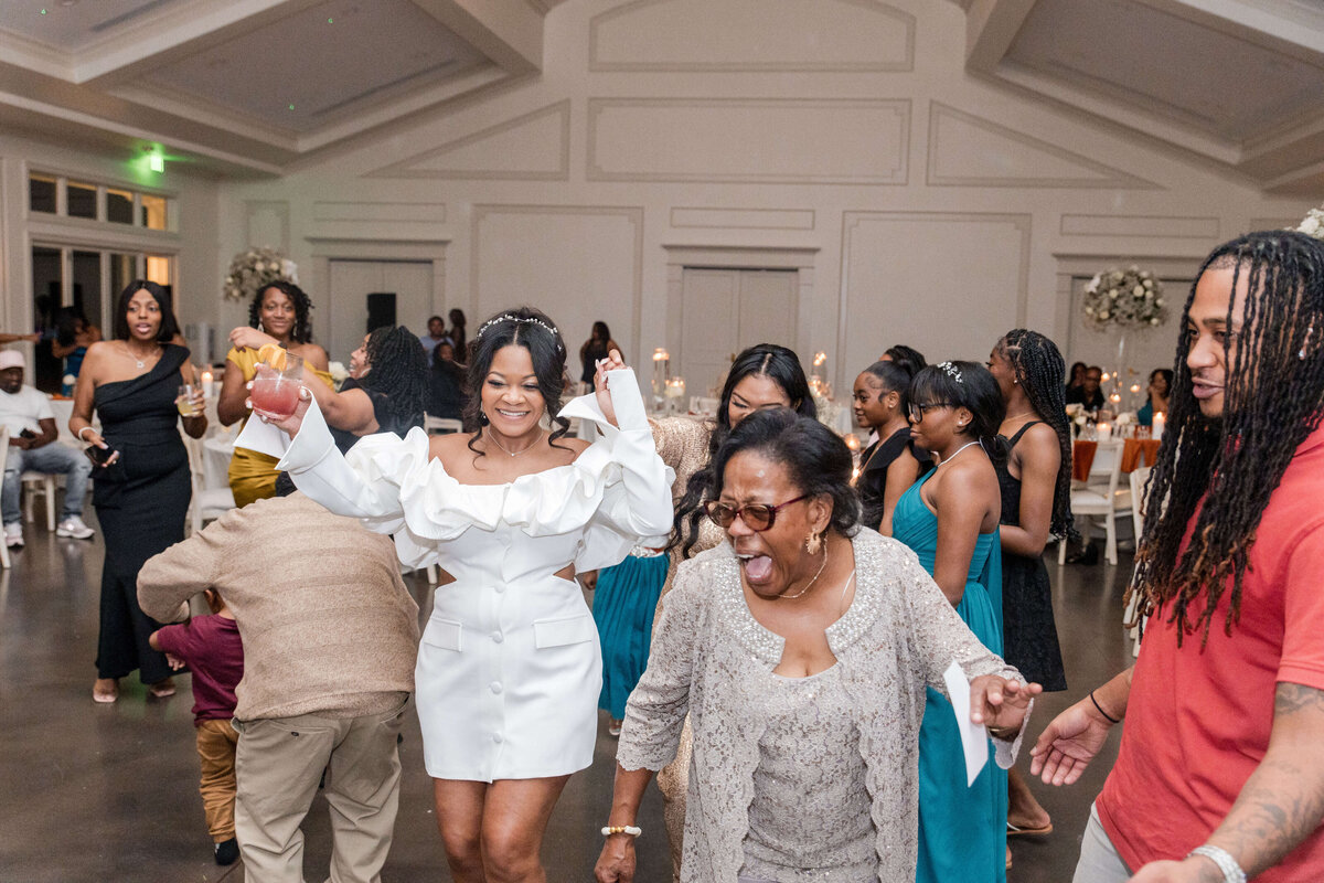 The bride and her bridesmaids show off their best moves during the wedding reception.
