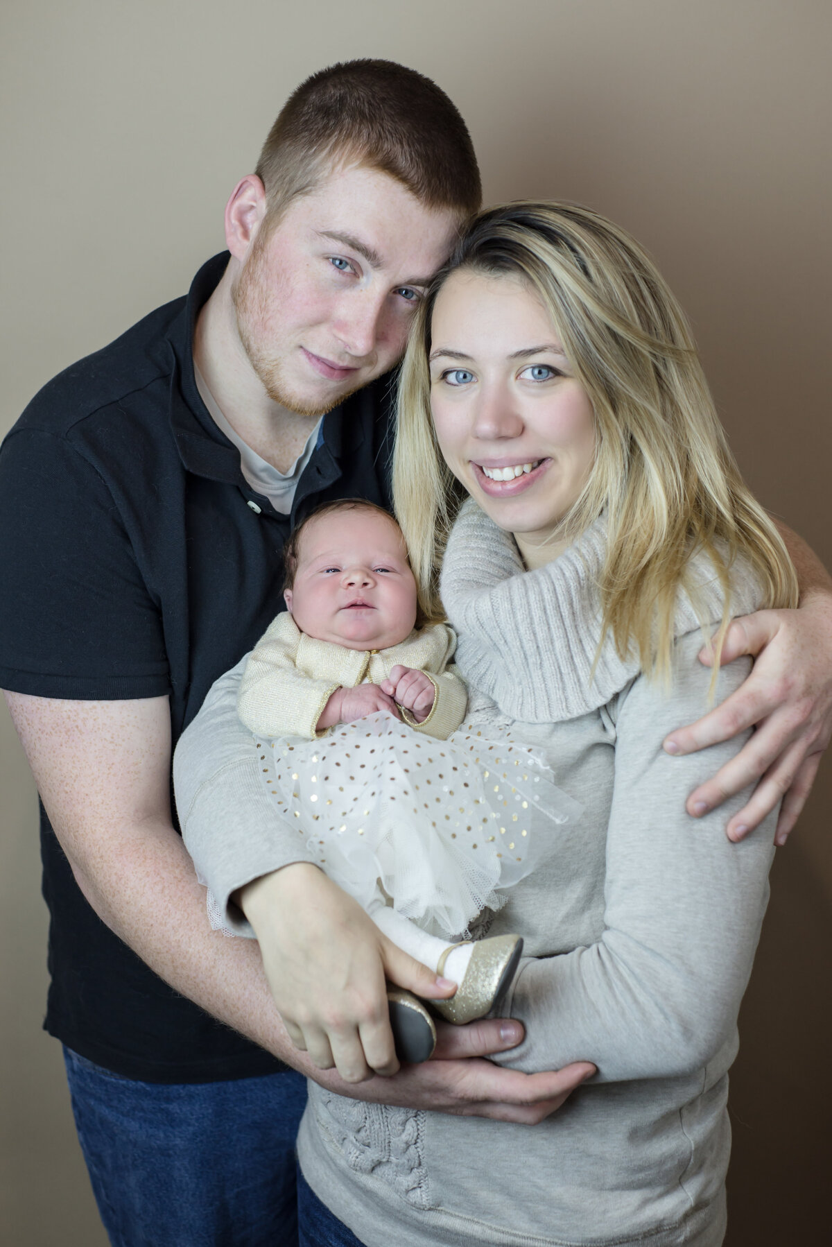 Newborn and her parents in portrait in Southern Maine