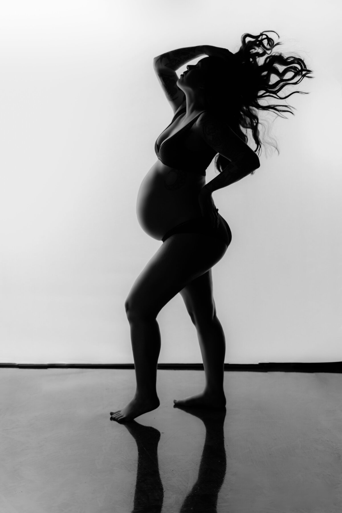silhouette of a pregnant expecting mother maternity photo